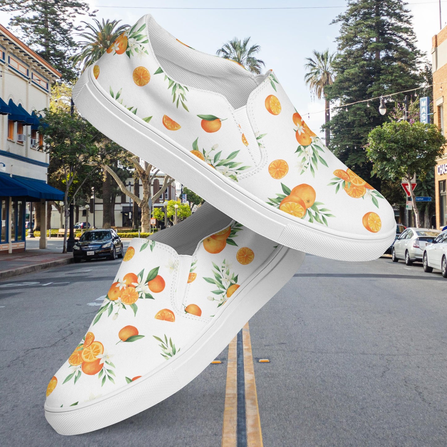 Orange Floral Women’s slip-on canvas shoes in White